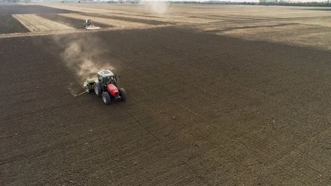 Red Tractor Mounted Seed Drill Plants the Seeds in the Soil in the Experimental Stock Footage 84660425