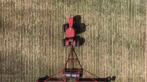 Red Tractor Pulling Roller Stock Footage 156472360