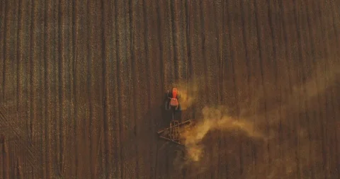 A red tractor at sunset Stock Footage 118688384