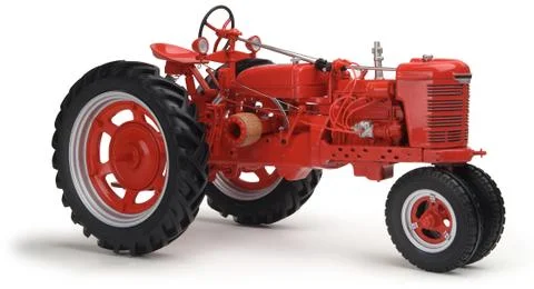 Red tractor on white background Фото