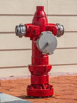 Red traditional fire hydrant on side walk, for fireman use Stock Photos