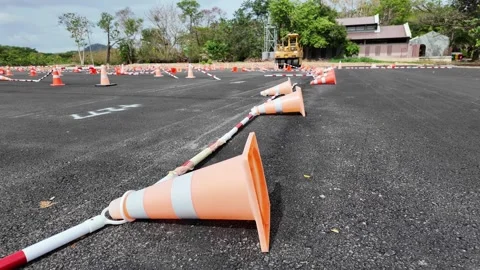 Red traffic cone on asphalt Stock Footage 305985143