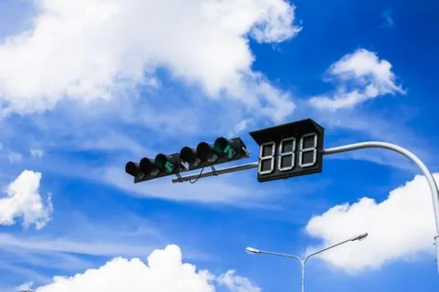 Red traffic light against blue sky Stock Photos