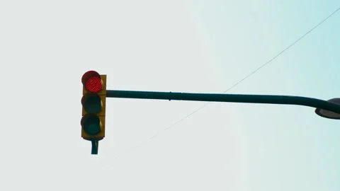 Red traffic light changing to green at city intersection in daylight. Signal 스톡 동영상 342334356