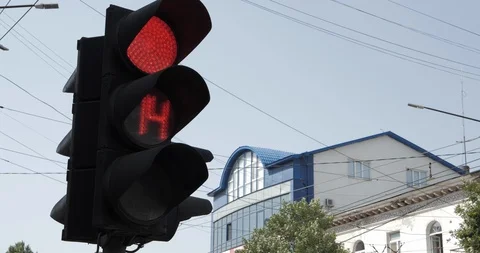 Red traffic light with countdown changes digits on street Stock Footage 124262693