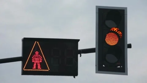 Red traffic light illuminating the night, creating a striking visual contrast Stock Footage 256737623