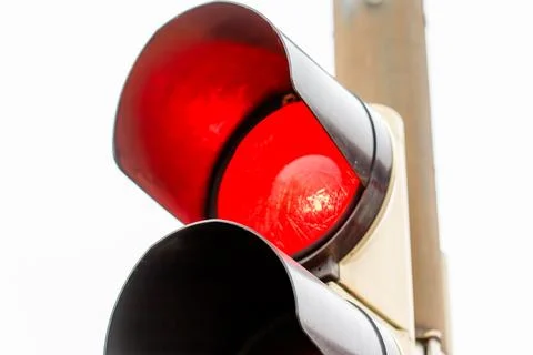Red traffic light indicating stop signal for vehicles Stock Photos