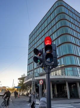 Red traffic light on the intersection of Bernstorffsgade and Carsten Niebuhrs Stock Photos