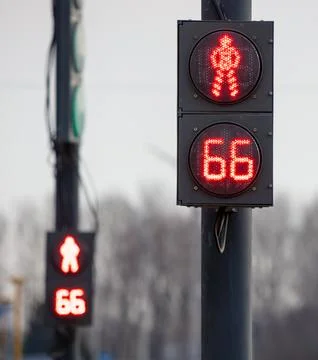 Red traffic light for a pedestrian with a countdown Stock Photos