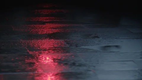 Red traffic light reflecting on wet asphalt Stock Footage 124621344