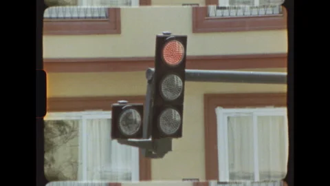 Red traffic light at urban intersection on Super 8 film Stock Footage 344441201