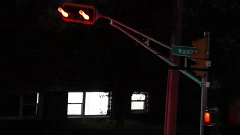 Red Traffic Lights at Night on Mountain Road Intersection Stock Footage 330196541