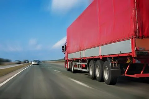 Red trailer on the highway Stock Photos
