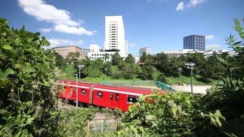Red train and blue sky in Tokyoo Japan. Stock Footage 220097644