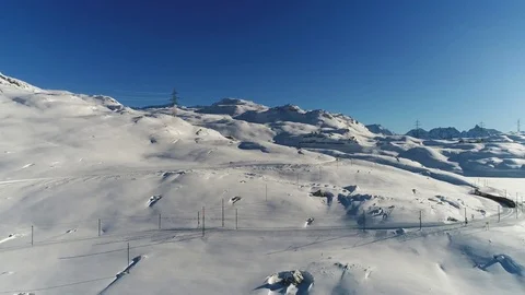 Red train of Bernina, Bernina Express. Aerial view with drone Video stock 83443895