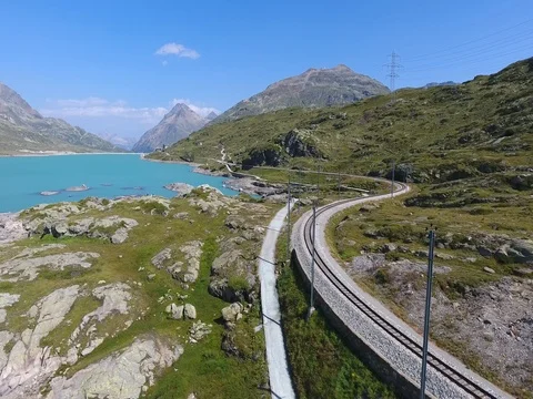 Red train on Bernina Pass - Engadine, aerial view Stock Footage 78342895