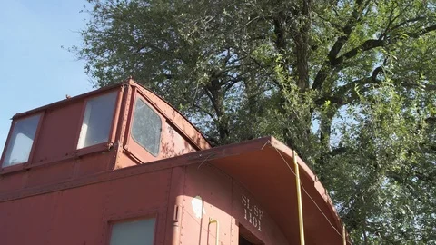 A Red Train Car Sits In A Small Town Stock Footage 87480220