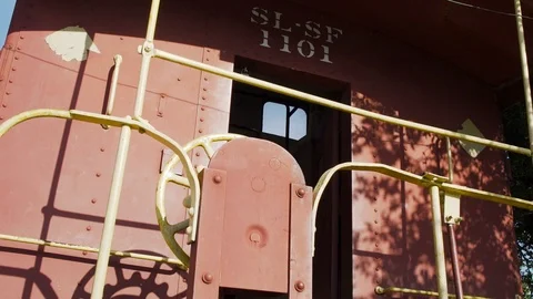 A Red Train Car Sits In A Small Town Stock Footage 87480261