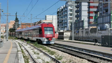 Red train departures from the train station in Bari in Italy Stock Footage 150081464