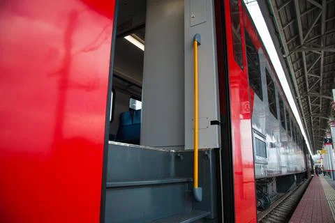 Red train in modern railway Stock Photos
