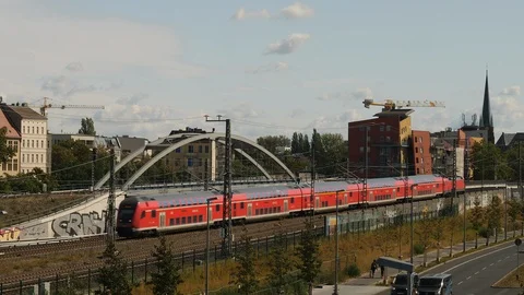 Red train riding through residential area in Berlin, Germany. Stock Footage 119117982