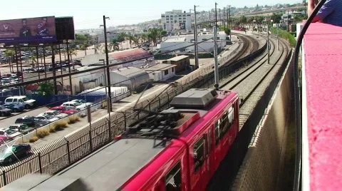 Red train speeding by HD Stock Footage