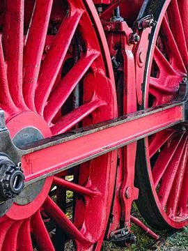 The red train wheel is in the foreground Foto stock