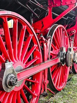 The red train wheel is in the foreground Stock Photos