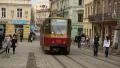 Red tram and people near the Market Square in Lviv, Western Ukraine HD Footage