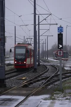 Red Tram Approaching in Winter Stock Photos