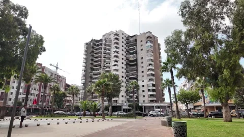 Red Tram Crossing Mohammed V Square in Casablanca, Morocco August 3, 2025 Stock Footage 314309181