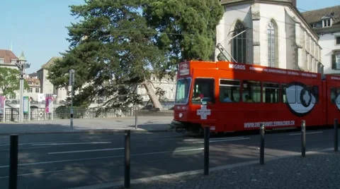 Red tram in front of church Stock Footage 45983561