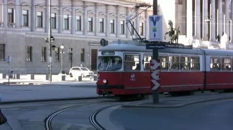 Red Tram going round a bend in Vienna town center Stock Footage 22144875