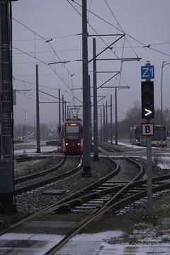 Red Tram in Winter Urban Setting Stock Photos