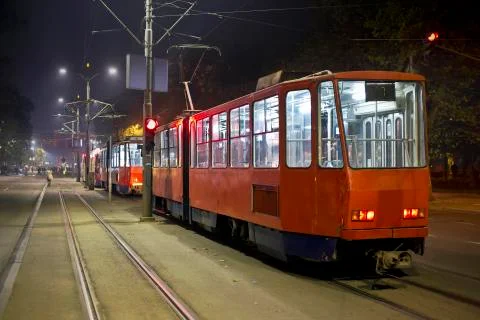 Red trams in the night Stock Photos