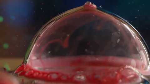 Red Translucent Bubble Pops Stock Footage 75503510