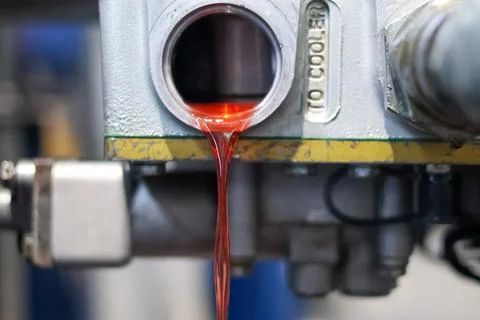 Red Transmission Fluid Flowing From Engine Block. Stock Photos