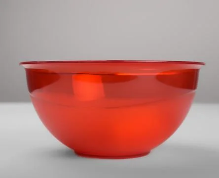 Red transparent plastic deep dish, front view Stockfoto's