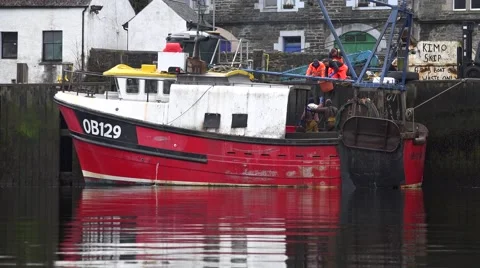 RED TRAWLER AT TARBERT Stock Footage 68992976