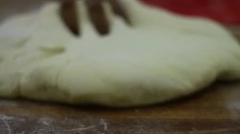 Red tray CU Dough pulled away Stock Footage 9442334