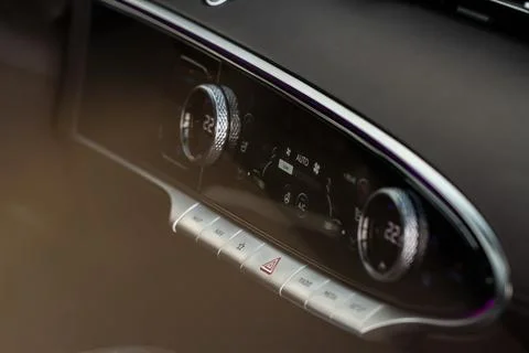 Red triangle hazard light button on car dashboard. Car media buttons dashboar Stock Photos