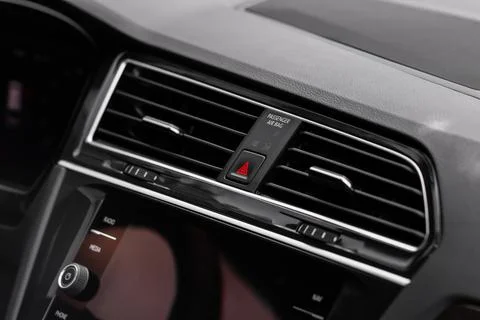 Red triangle hazard light button on car dashboard. Car media buttons dashboar Foto stock