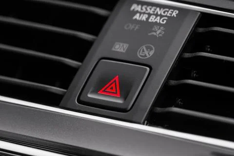 Red triangle hazard light button on car dashboard. Car media buttons dashboar Foto stock