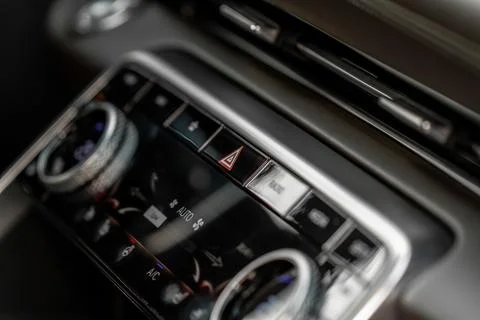 Red triangle hazard light button on car dashboard. Car media buttons dashboar Stock Photos
