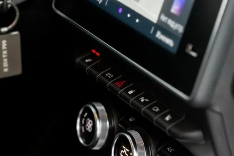 Red triangle hazard light button on car dashboard. Car media buttons dashboar Stock Photos