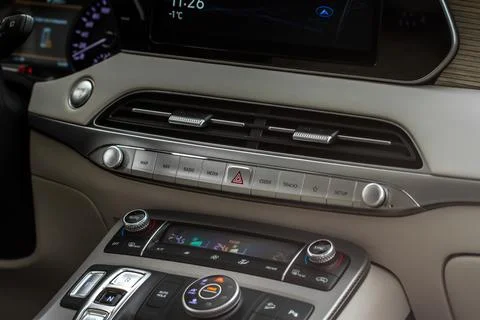 Red triangle hazard light button on car dashboard. Car media buttons dashboar Stock Photos