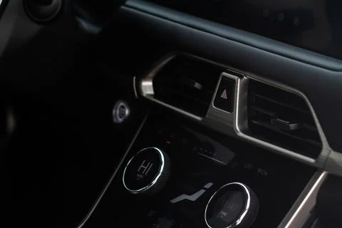 Red triangle hazard light button on car dashboard. Car media buttons dashboar Stock Photos