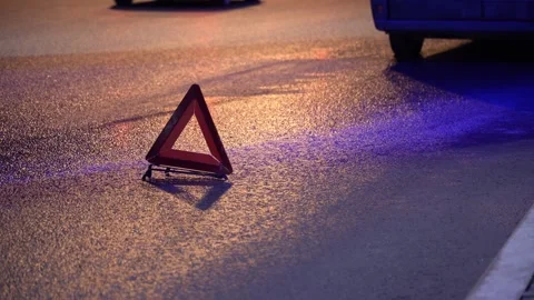 A red triangle is laying on the road Video stock 291582031