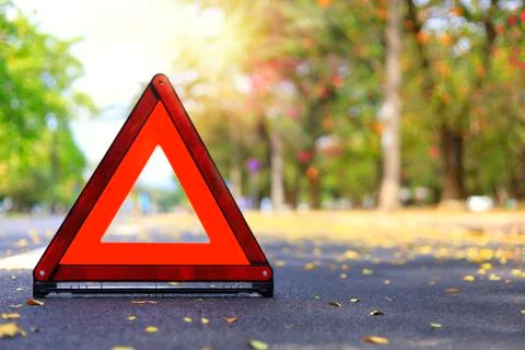 Red triangle, red emergency stop sign, red emergency symbol on road. With cop Stock Photos
