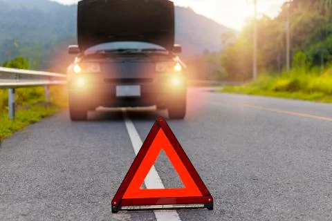 Red triangle, red emergency stop sign, red emergency symbol and black car sto Stock Photos